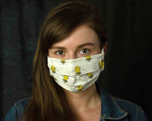 girl wearing white bees filter mask