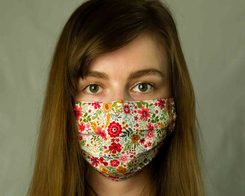 girl wearing white washable face mask