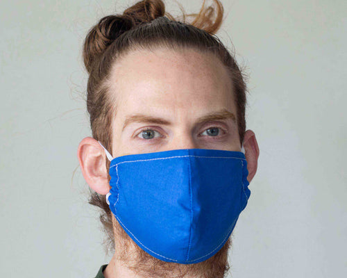 guy wears reusable face mask blue orange